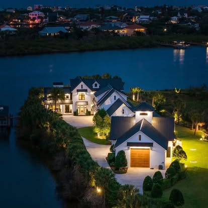 Custom waterfront home at dusk, Flagler